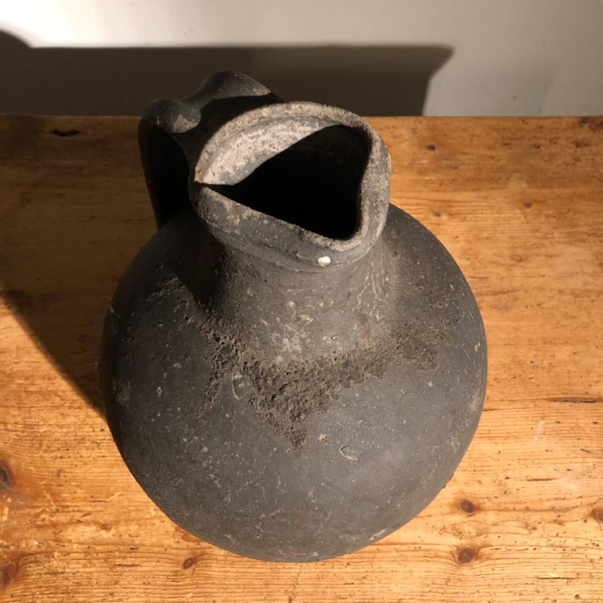 Black primitive vase
