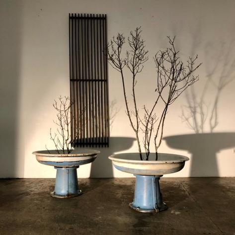 Pair of large metal planters 