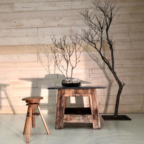 Primitive side table with blue stone 